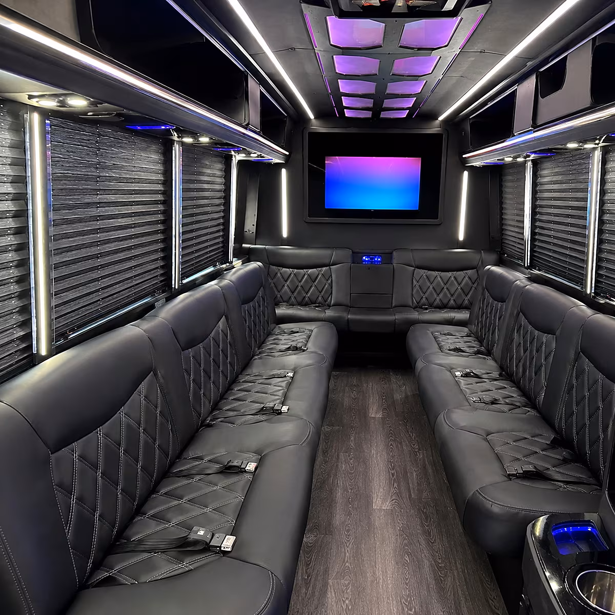 Friends laughing during a party bus celebration in Cincinnati